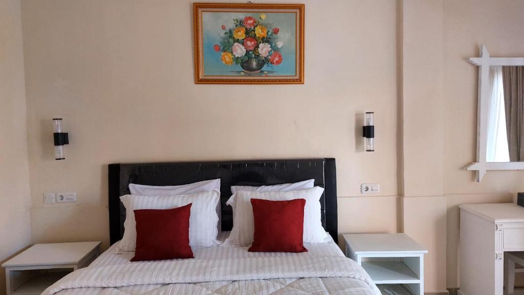 Postel nebo postele na pokoji v ubytování Grand Melka Hotel