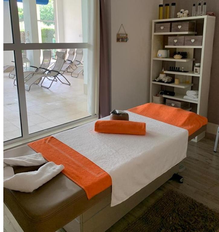 Postel nebo postele na pokoji v ubytování Hotel Bella Lazise
