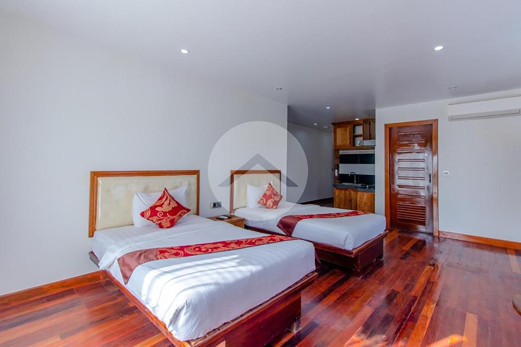Postel nebo postele na pokoji v ubytování Zita Angkor Hotel