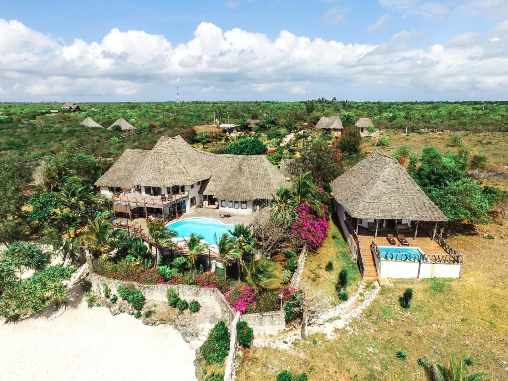 an aerial view of a resort with a swimming pool at Zi Loft Beach Cottage in Matemwe