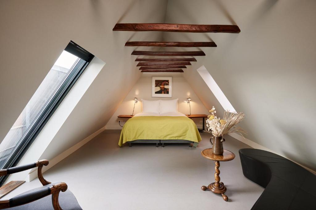 Postel nebo postele na pokoji v ubytování Hotel Miss Blanche