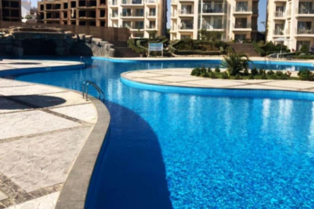 The swimming pool at or close to SUNNY BEACH resort apartment for rent in Montazah