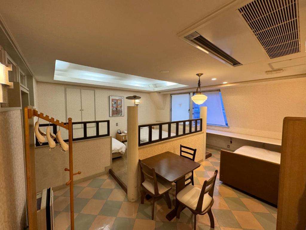 Postel nebo postele na pokoji v ubytování ホテルカスカベ Hotel Kasukabe