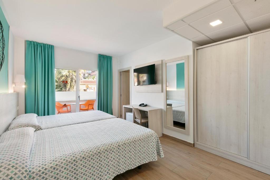 Posteľ alebo postele v izbe v ubytovaní Hotel Best Lloret Splash