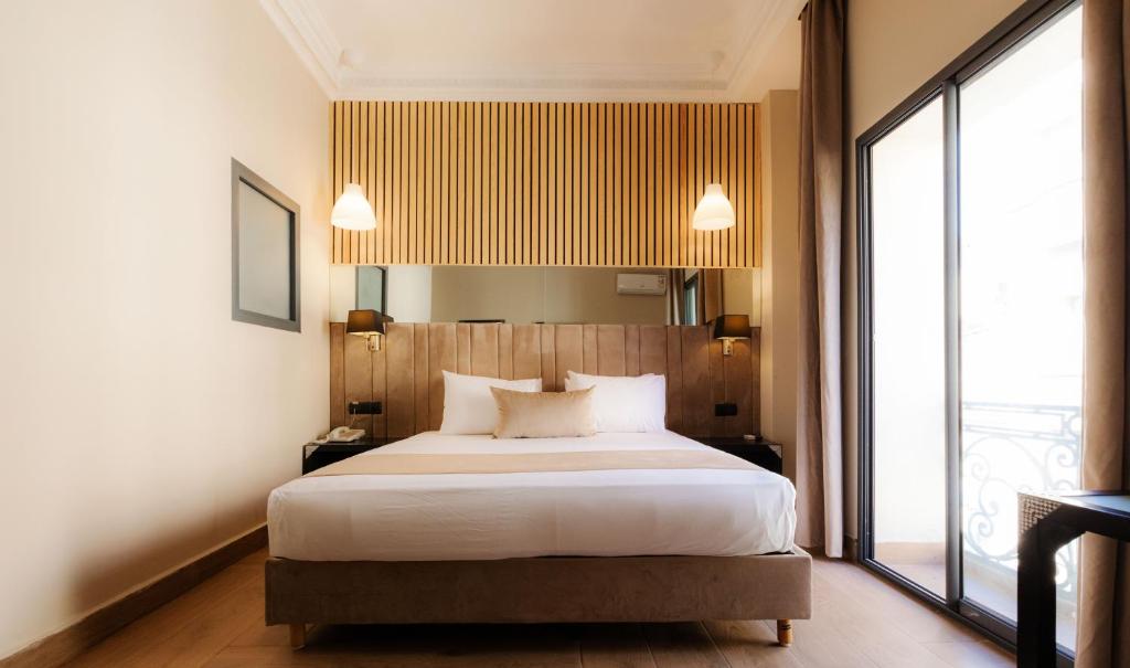 Postel nebo postele na pokoji v ubytování Ennesma Hotel