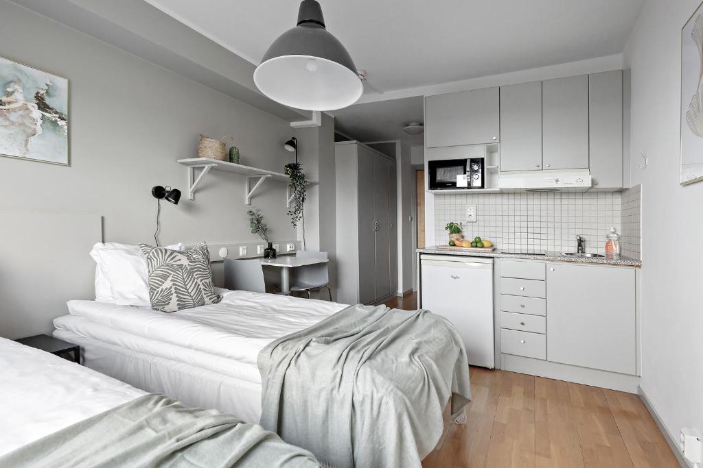 Postel nebo postele na pokoji v ubytování Forenom Aparthotel Stockholm Alvik