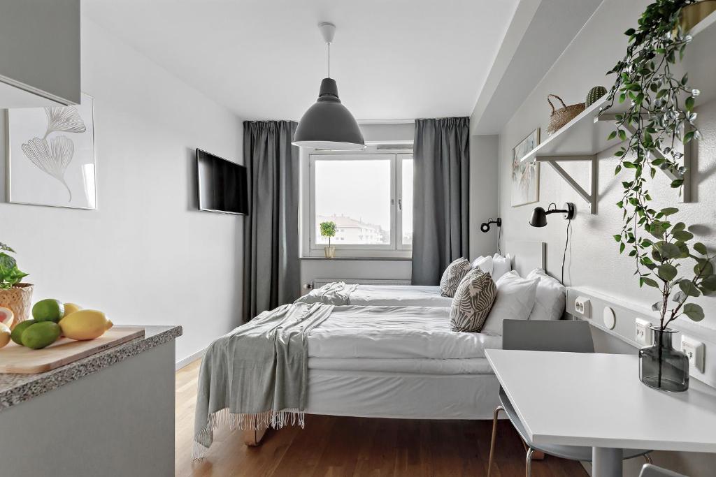 Postel nebo postele na pokoji v ubytování Forenom Aparthotel Stockholm Alvik