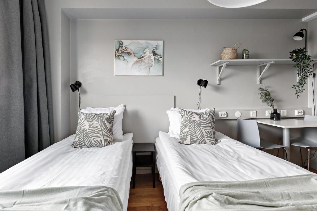 Postel nebo postele na pokoji v ubytování Forenom Aparthotel Stockholm Alvik