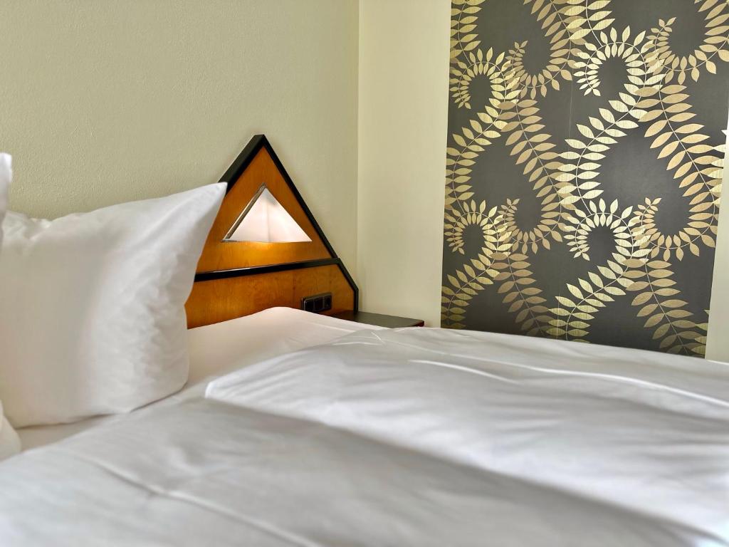 Postel nebo postele na pokoji v ubytování Hotel Residenz