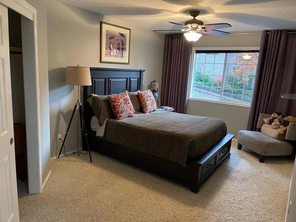 a bedroom with a bed and a window at Forest & City Views - Near Portland, Nike & Intel in Beaverton