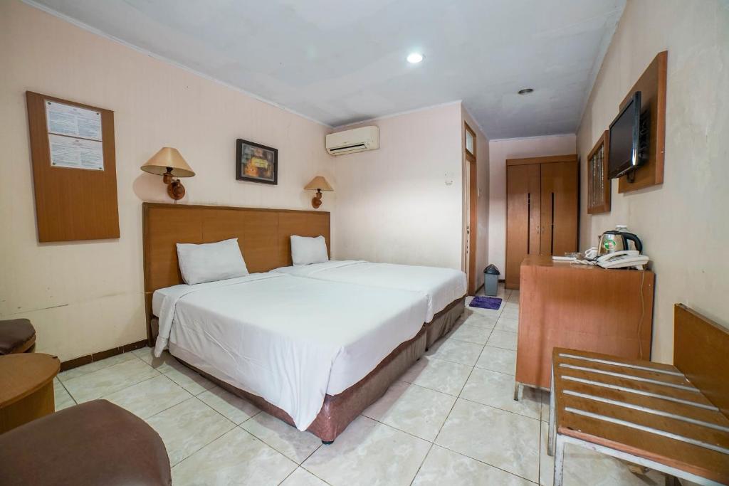 Postel nebo postele na pokoji v ubytování Hotel Kalisma by Alia