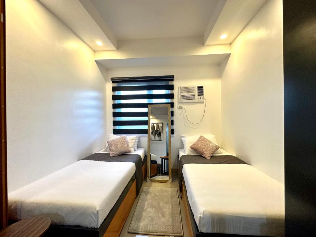 Ένα ή περισσότερα κρεβάτια σε δωμάτιο στο M&Ms Place