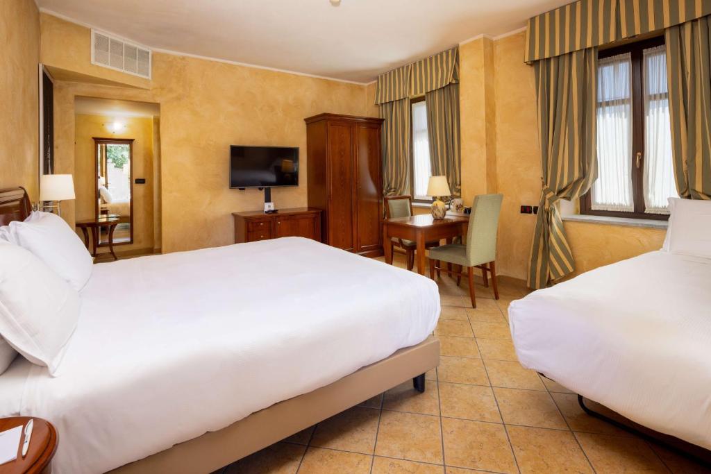 Łóżko lub łóżka w pokoju w obiekcie Best Western Plus Hotel Le Rondini