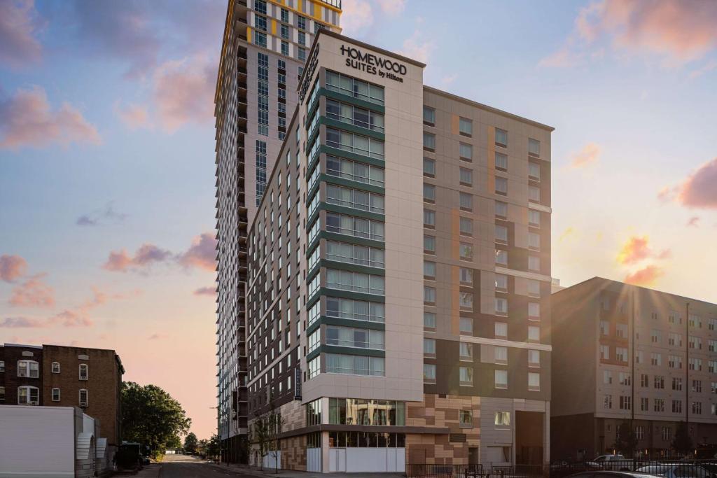 a rendering of a tall building with a sign on it at Homewood Suites By Hilton Charlotte Uptown First Ward in Charlotte