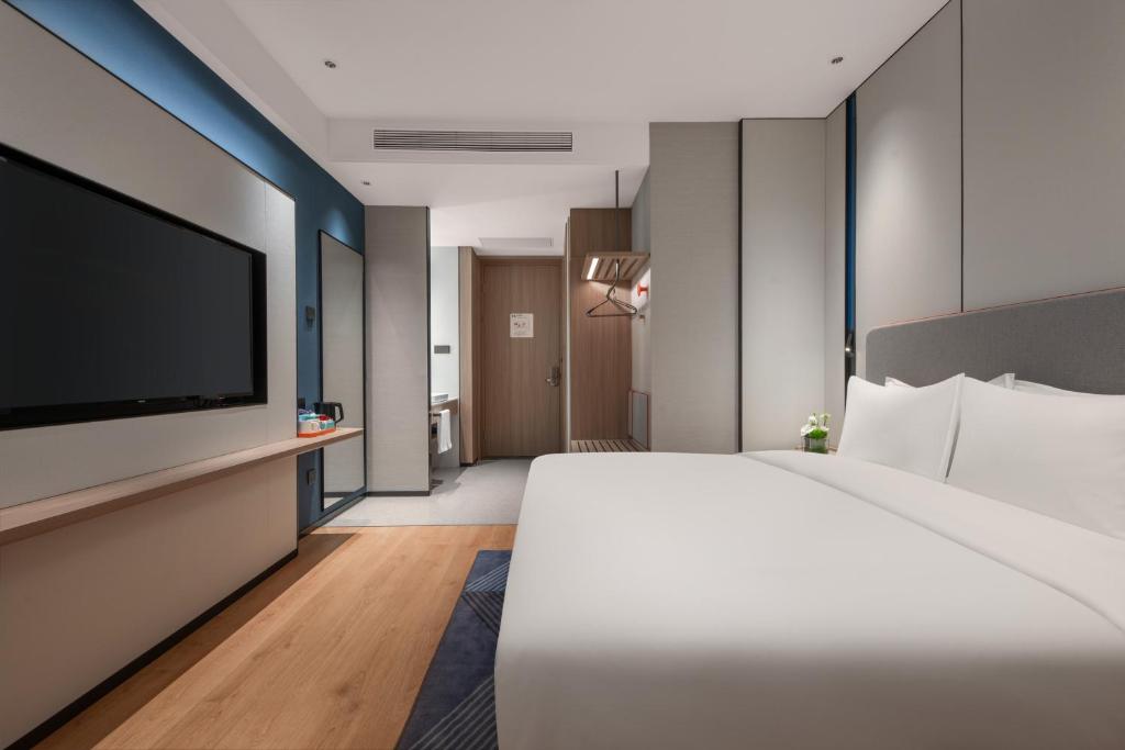 Postel nebo postele na pokoji v ubytování Holiday Inn Express Shantou Chenghai