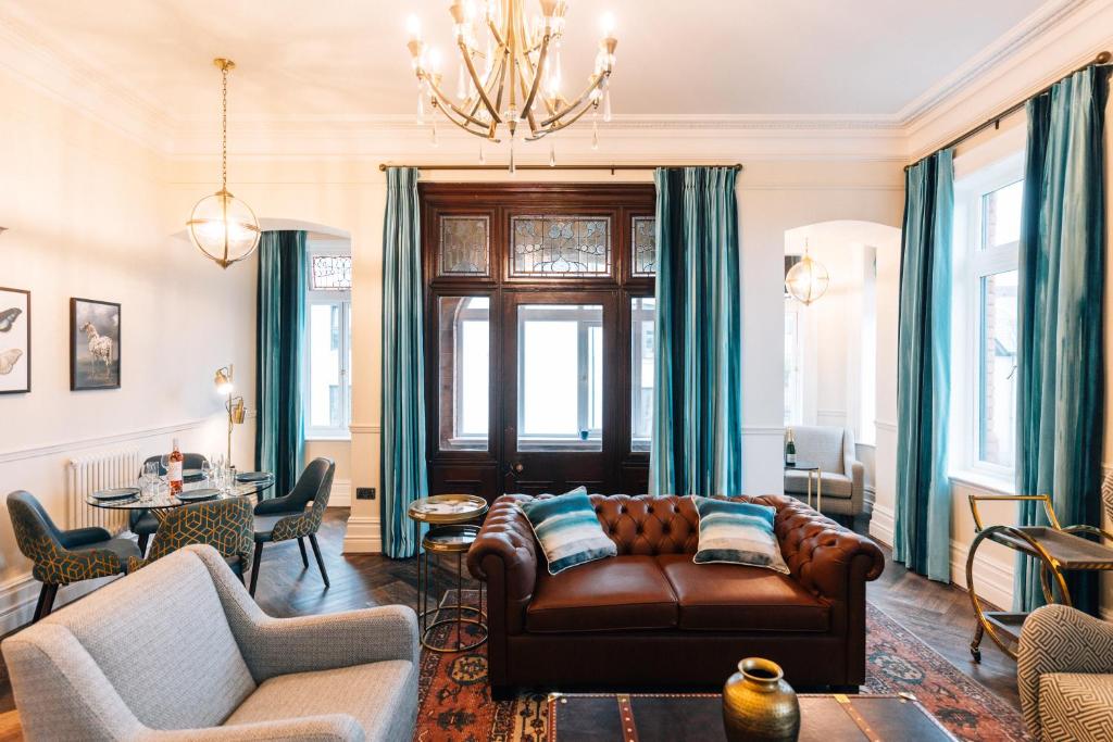 a living room with a couch and a table at Bank Apartments Portrush in Portrush