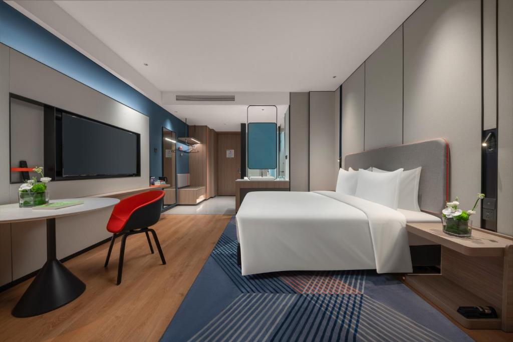 Postel nebo postele na pokoji v ubytování Holiday Inn Express Shantou Chenghai