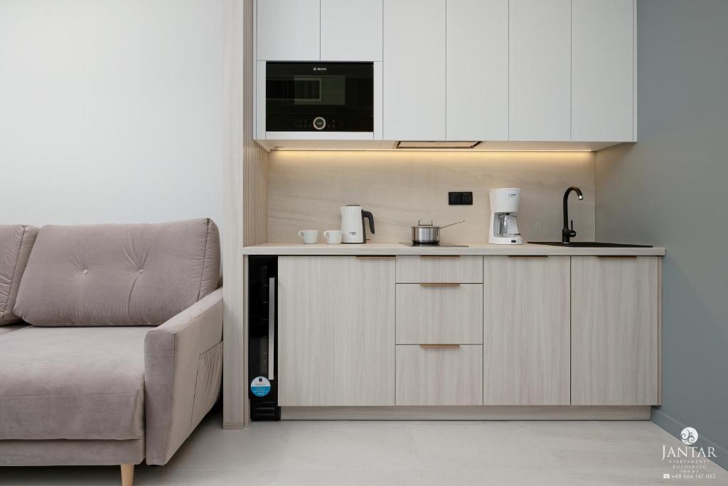 Kuchyňa alebo kuchynka v ubytovaní Shellter Apartments 117 Ł - by Jantar Apartamenty