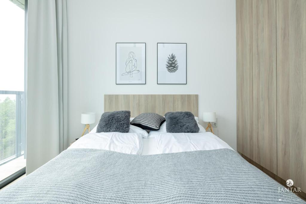 Posteľ alebo postele v izbe v ubytovaní Shellter Apartments 117 Ł - by Jantar Apartamenty