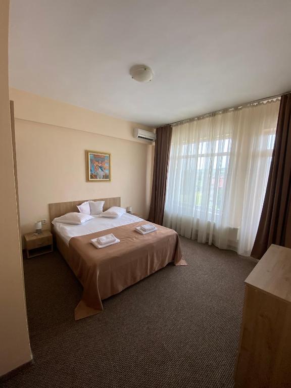 Una cama o camas en una habitaci&oacute;n de Hotel Diana