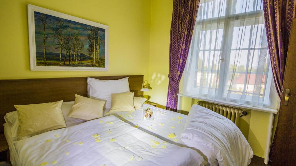 Postel nebo postele na pokoji v ubytování Hotel Veba