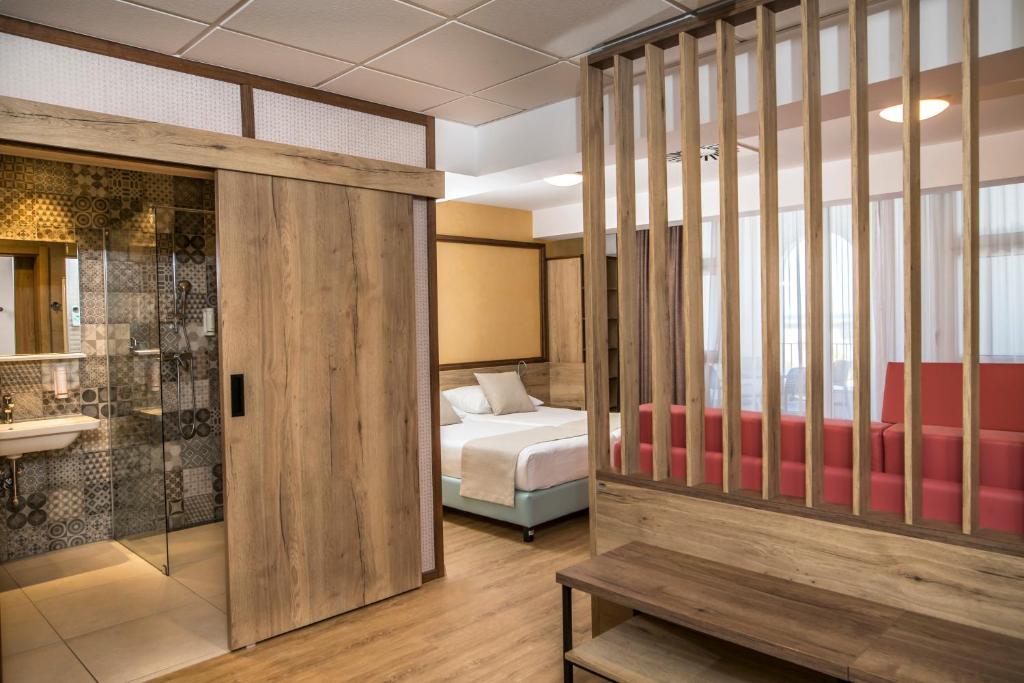 Postel nebo postele na pokoji v ubytování Hotel Delfin