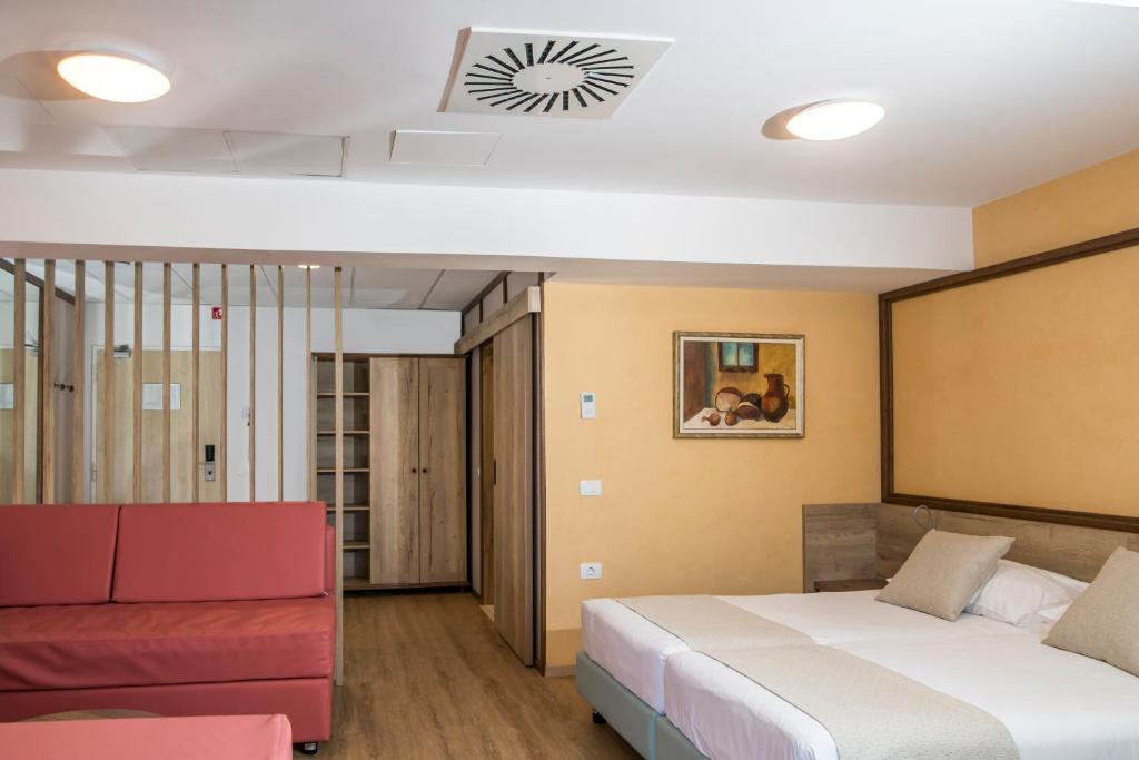 Postel nebo postele na pokoji v ubytování Hotel Delfin