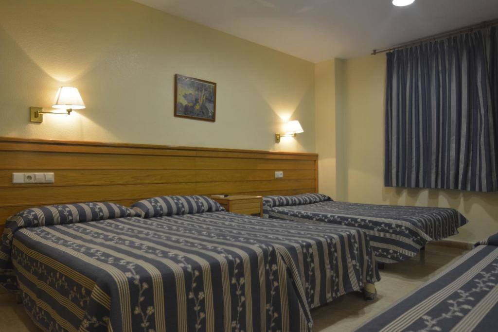 Postel nebo postele na pokoji v ubytování Casa Emilio