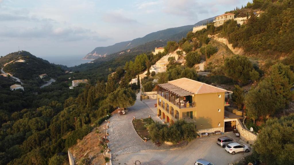 an aerial view of a building on a mountain at La Casa D' Irene in Agios Nikitas