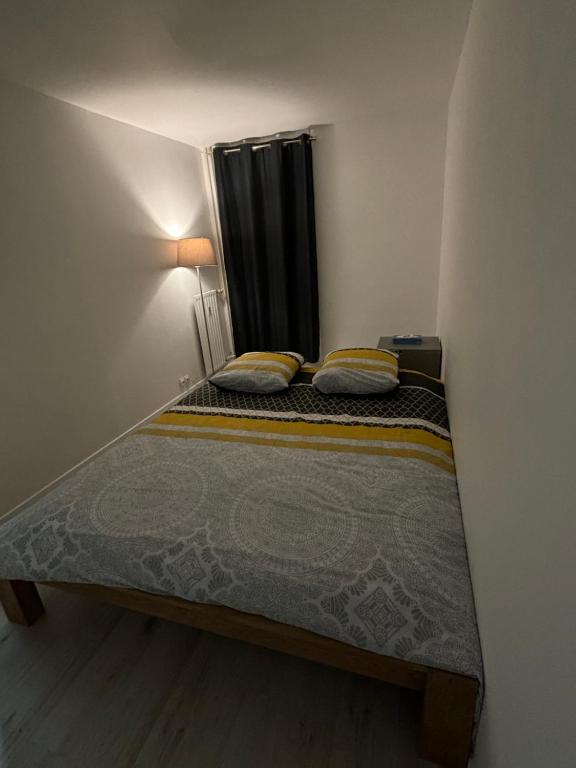 Katil atau katil-katil dalam bilik di Logement individuel ROUEN