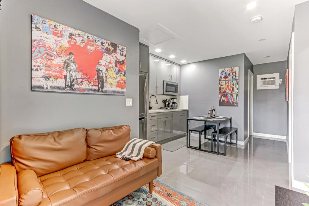 a living room with a couch and a kitchen at Modern Rental - Pet-Friendly, Free Parking in Hollywood
