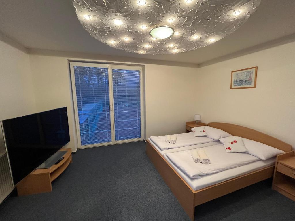 Voodi või voodid majutusasutuse Raketa Residence, hotel & restaurant toas