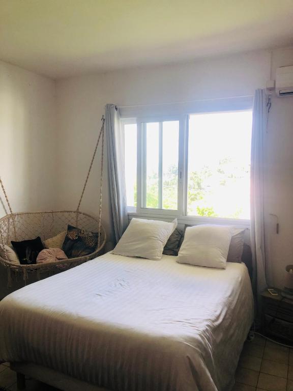 Postel nebo postele na pokoji v ubytování Chambre d'Hôtes Caïpi