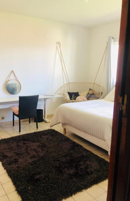 Postel nebo postele na pokoji v ubytování Chambre d'Hôtes Caïpi