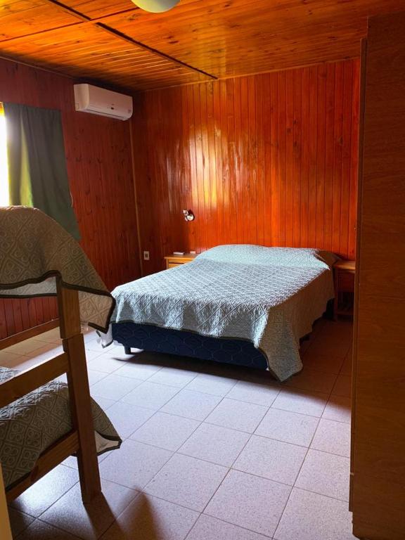 Postel nebo postele na pokoji v ubytování Cabañas Tacuabe