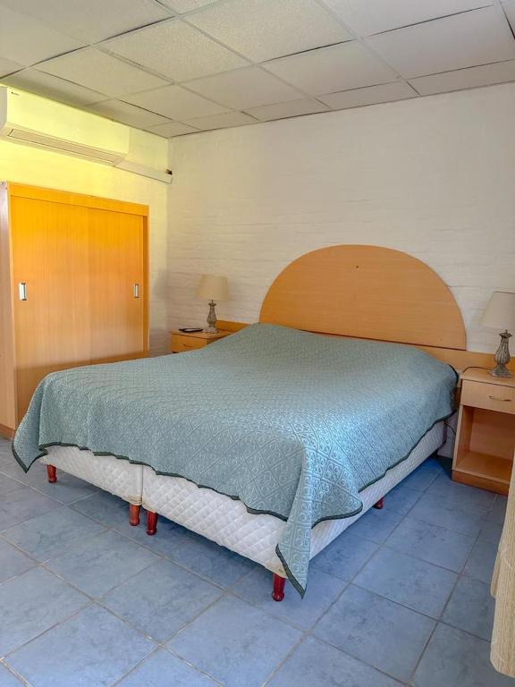Postel nebo postele na pokoji v ubytování Cabañas Tacuabe