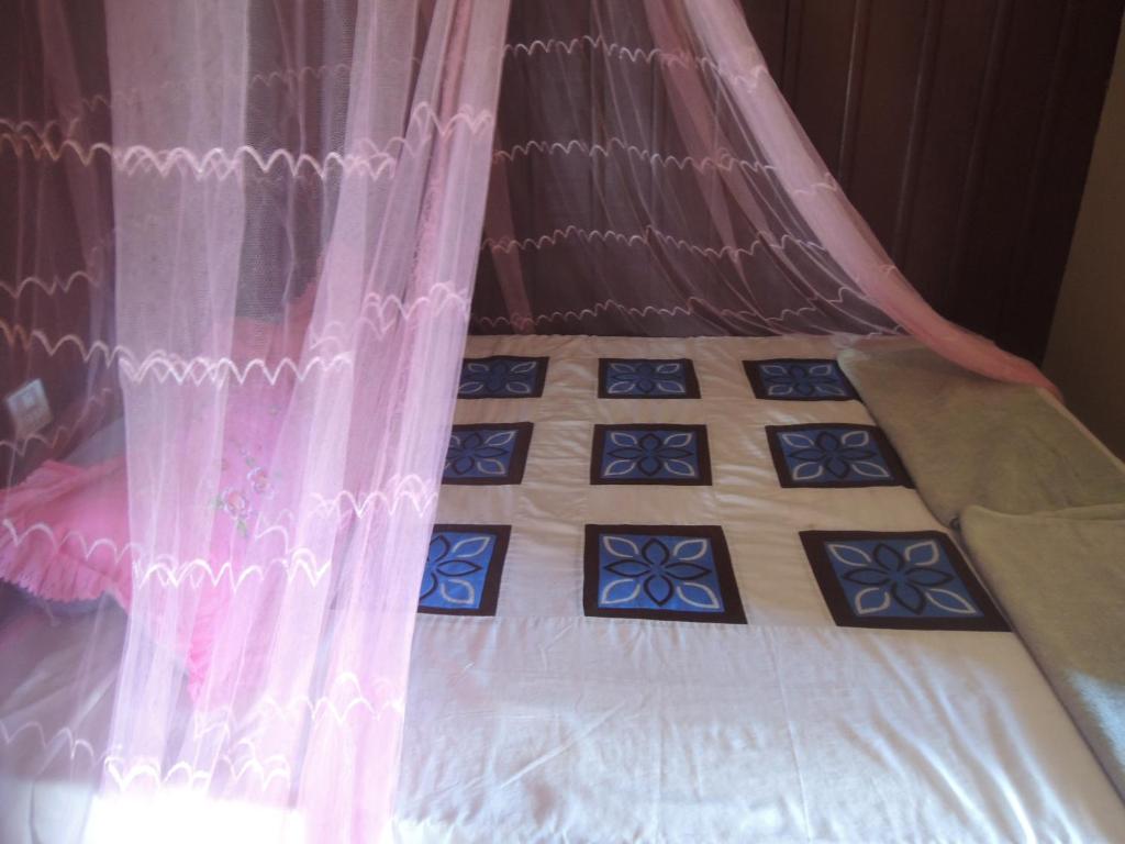 Postel nebo postele na pokoji v ubytování Bunyong Homestay