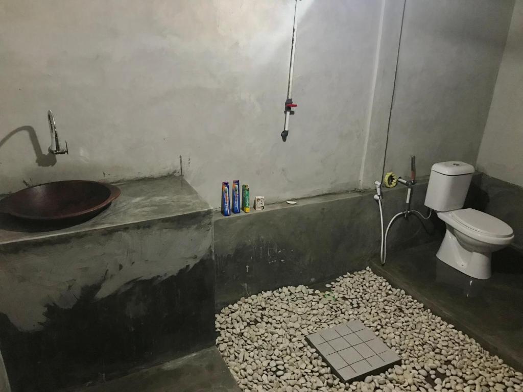 Koupelna v ubytování Muni's Lombok Bungalow