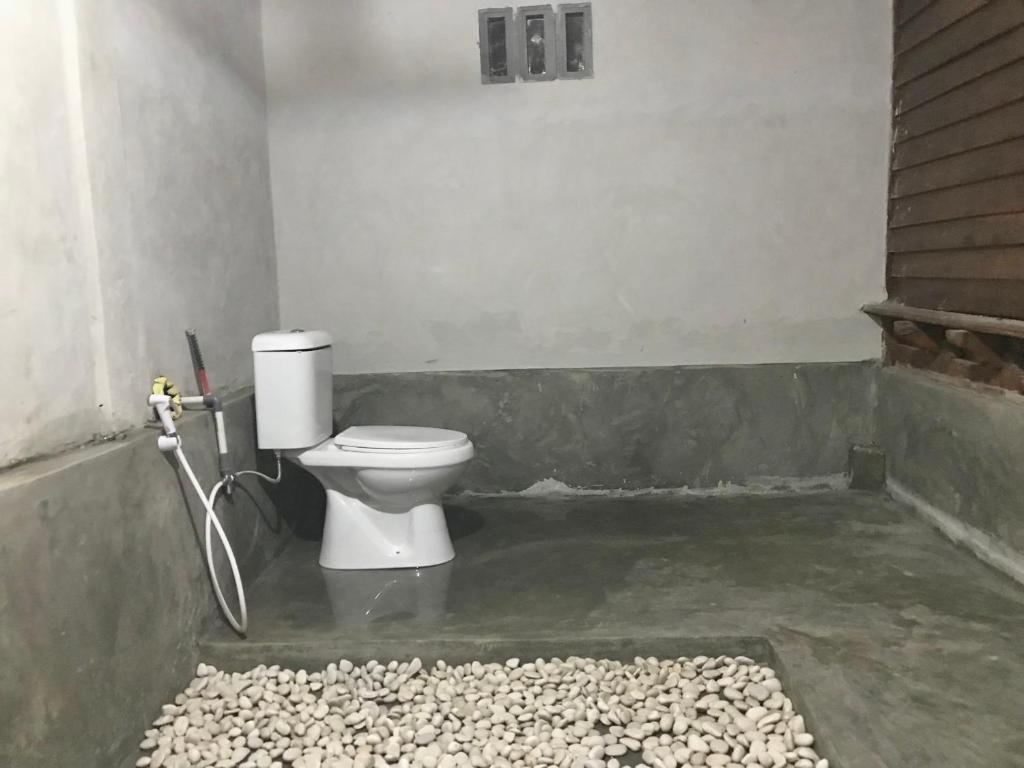 Koupelna v ubytování Muni's Lombok Bungalow