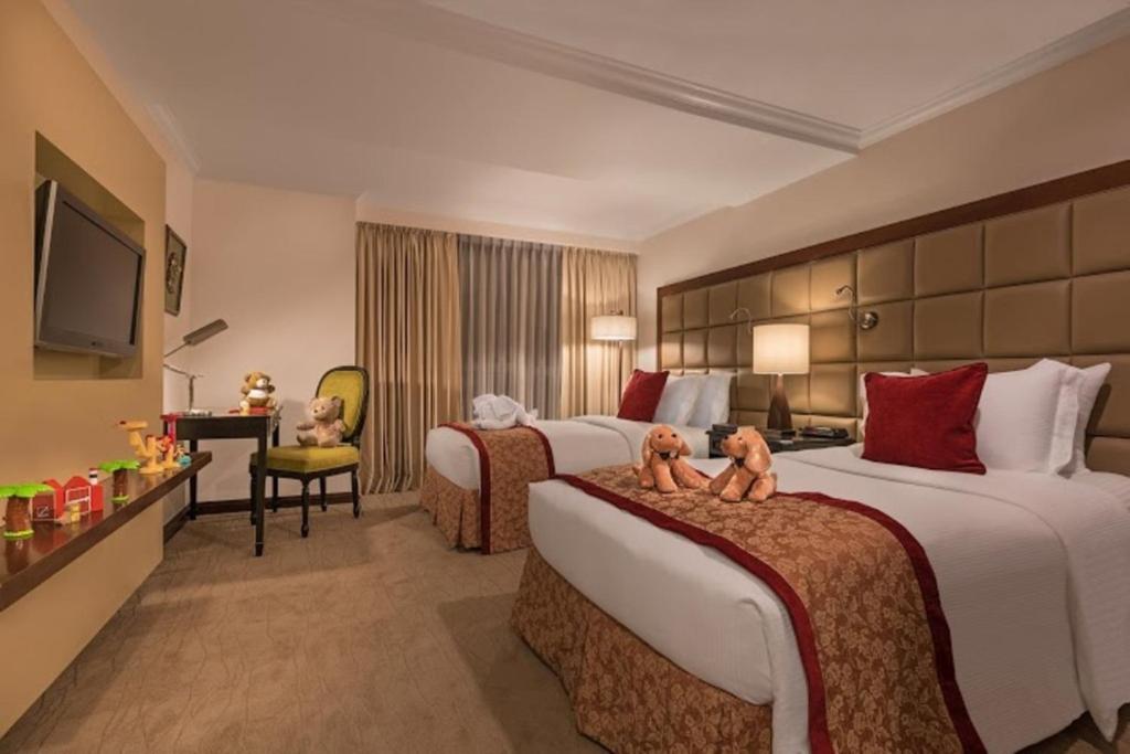 Discovery Suites Manila, Philippines客房内的一张或多张床位