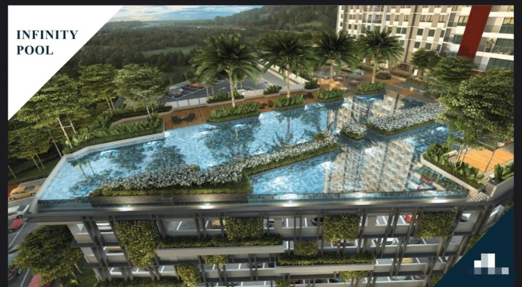 an aerial view of a building with a swimming pool at ReHut @ Setia Seraya by AzRaHomes in Putrajaya