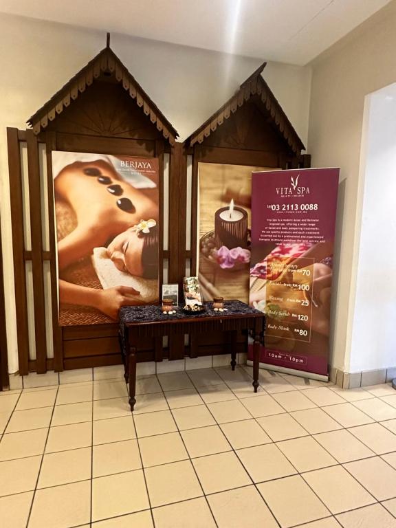 a room with two posters on the wall at Peak Suites At Times Square in Kuala Lumpur