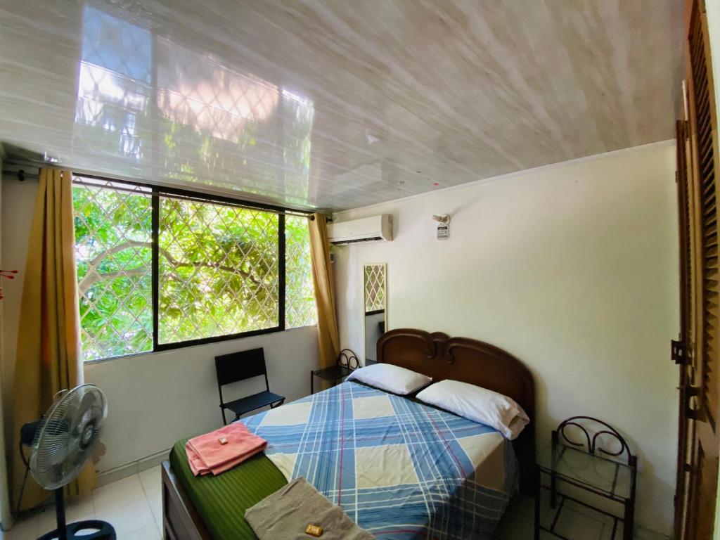 Voodi või voodid majutusasutuse Casa Feliz Hostal toas