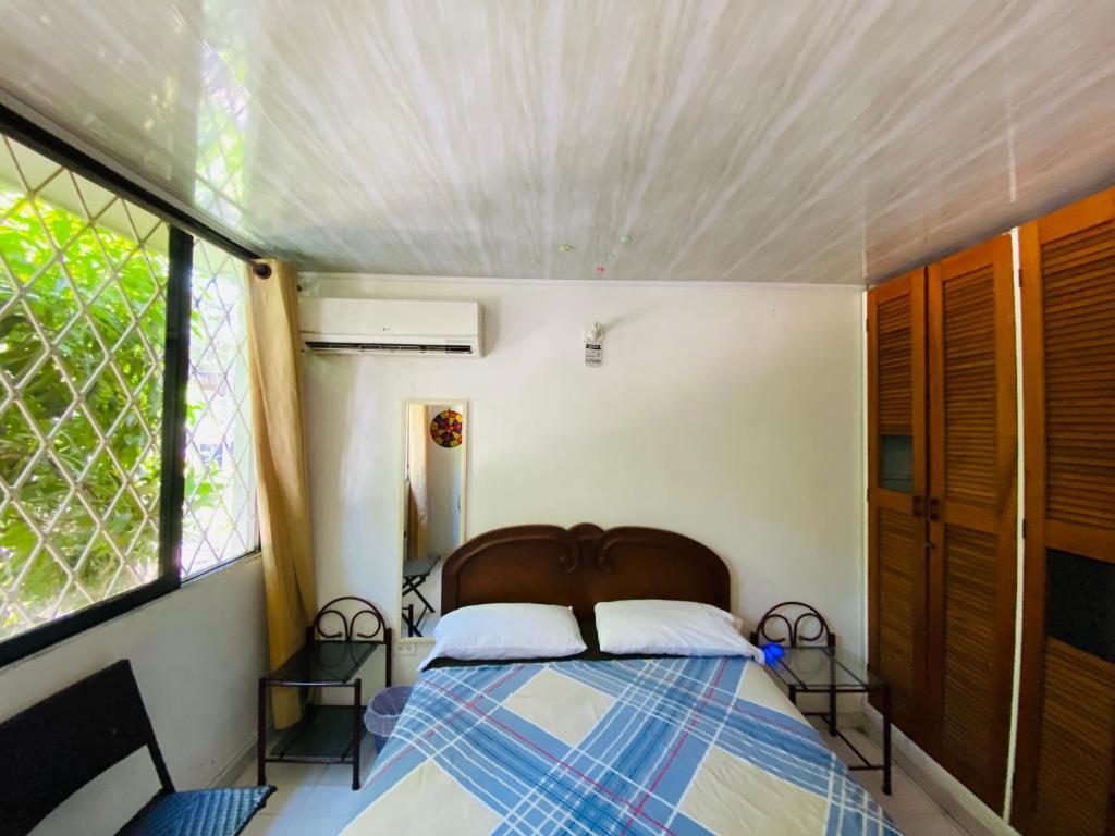 Voodi või voodid majutusasutuse Casa Feliz Hostal toas