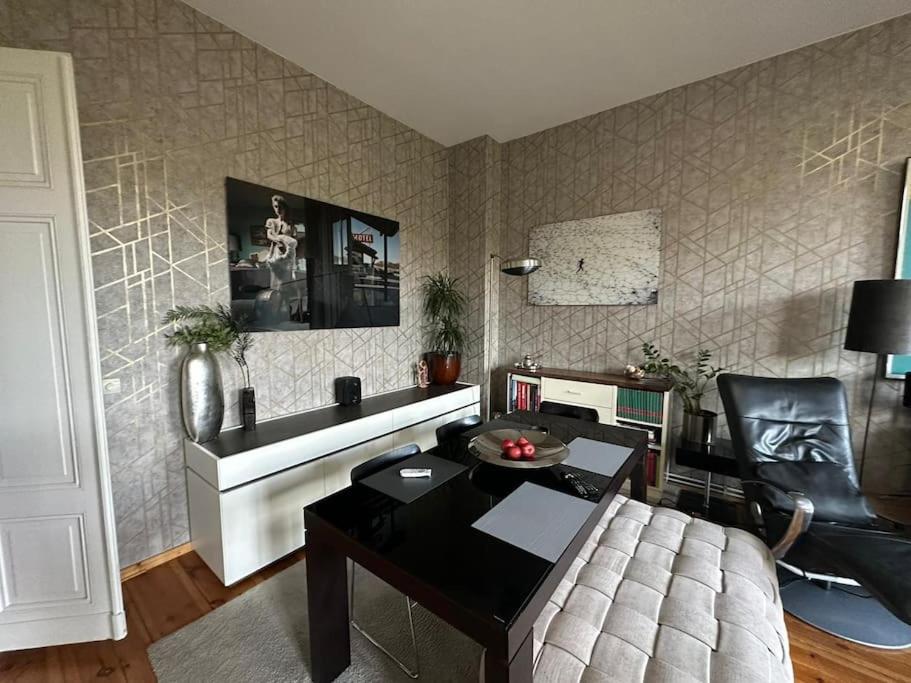 a living room with a couch and a table at Business apartment in Berlin in Berlin