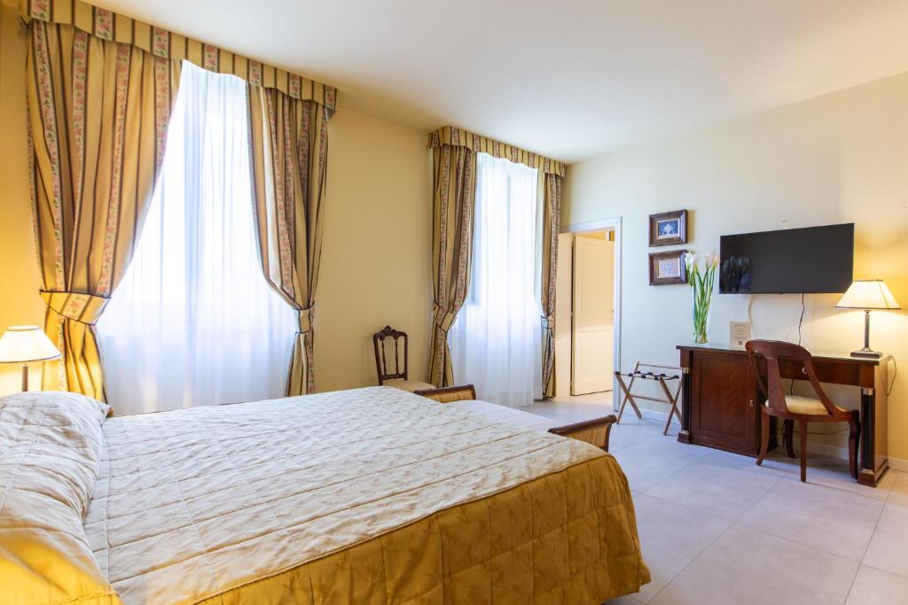 Postel nebo postele na pokoji v ubytování Hotel Sant'Andrea