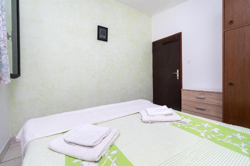 Posteľ alebo postele v izbe v ubytovaní Apartments Stefani