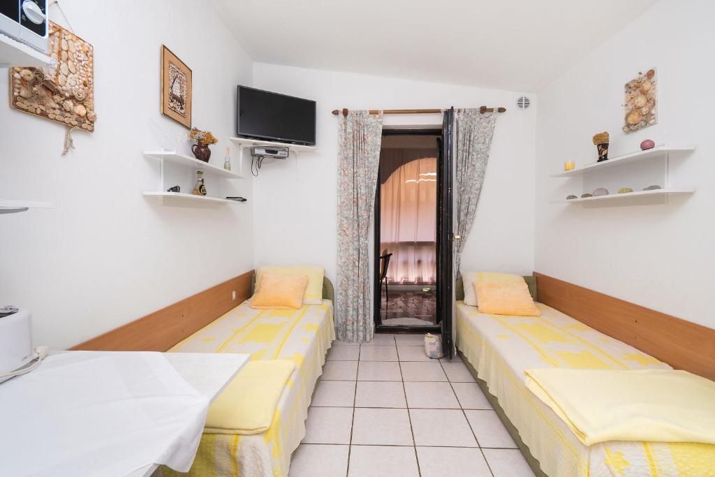 Posteľ alebo postele v izbe v ubytovaní Apartments Stefani