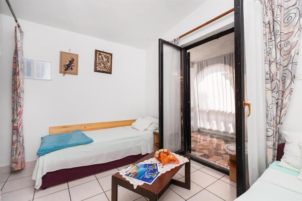 Posteľ alebo postele v izbe v ubytovaní Apartments Stefani