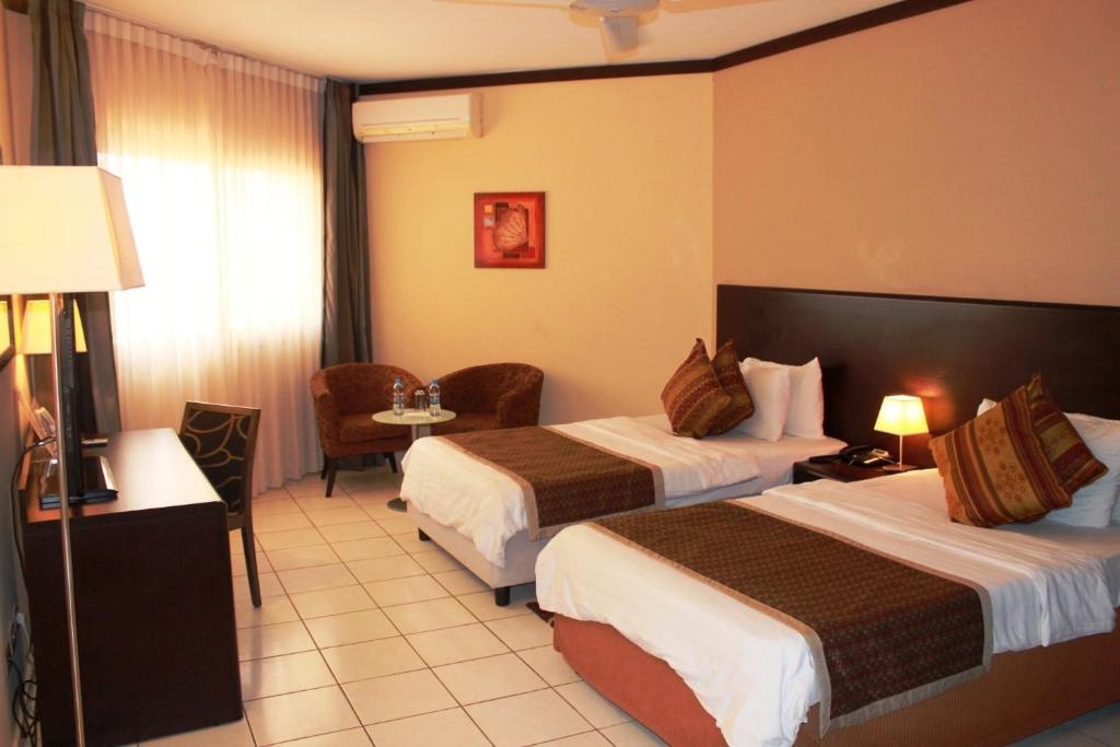 Posteľ alebo postele v izbe v ubytovaní Les Acacias Hotel Djibouti